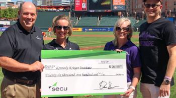 Left to right: David Sweiderk, president and CEO of SECU; Sarah Ryan, director of the SECU MD Foundation; Jen Doyle, director of leadership giving for Kennedy Krieger; and Dr. Bradley L. Schlaggar, president and CEO of Kennedy Krieger