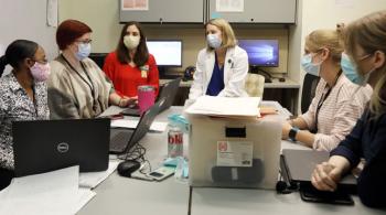 Pediatric Post-COVID-19 Rehabilitation Clinic staff members in a meeting.