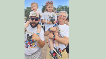 A photo of Rosie and Rowan with family members at Disneyworld.