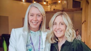 Photo of two smiling women, both with blond hair, at what appears to be a dressy event.