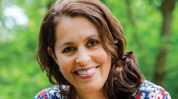 Dr. Beth Slomine headshot. The photo is taken outdoors.