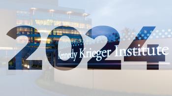 2024 overlayed above an image of the main entrance of Kennedy Krieger Institute's outpatient center.