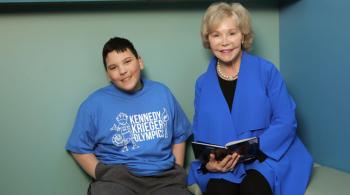 Dr. Nancy Grasmick and a student of Kennedy Krieger's Fairmount Campus.