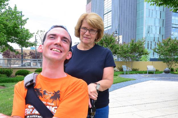 A photo of Kevin DiLegge and his mom on a sidewalk