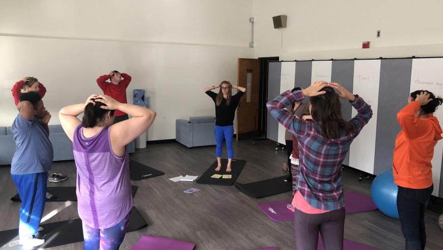 Students participate in yoga