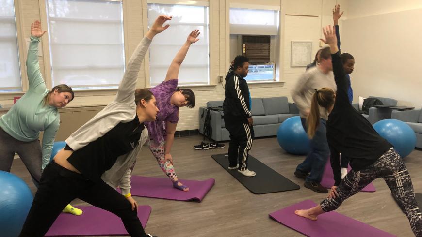 Students participate in yoga