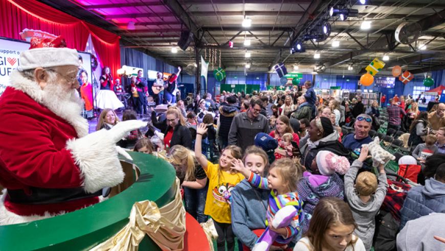 Santa visits children at the Festival of Trees