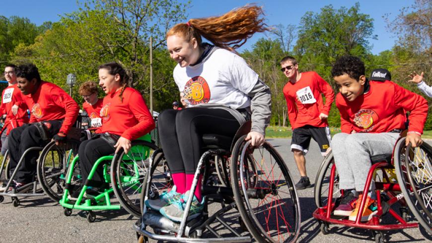 Members of the Bennett Blazers participate in the 2019 ROAR for Kids event