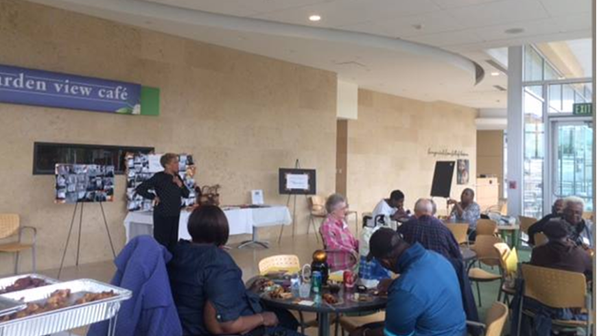 A woman speaks to attendees of the 2015 fall gathering. 