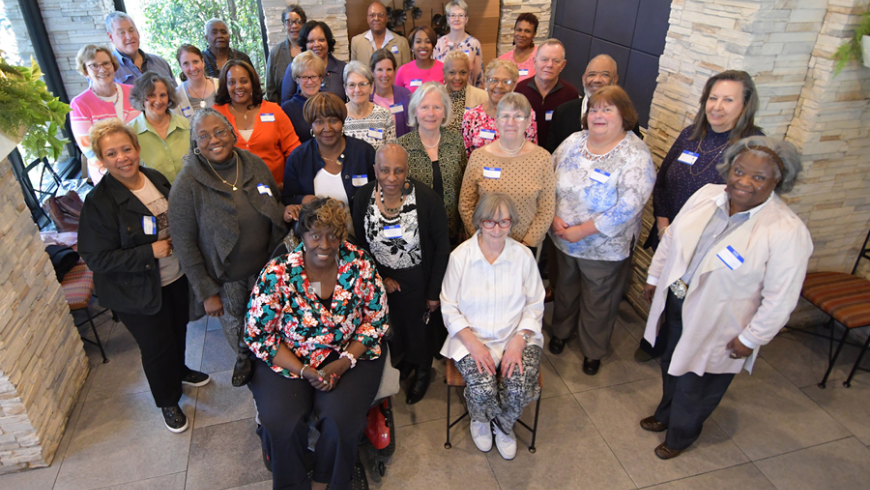 A large group poses for a photo. 