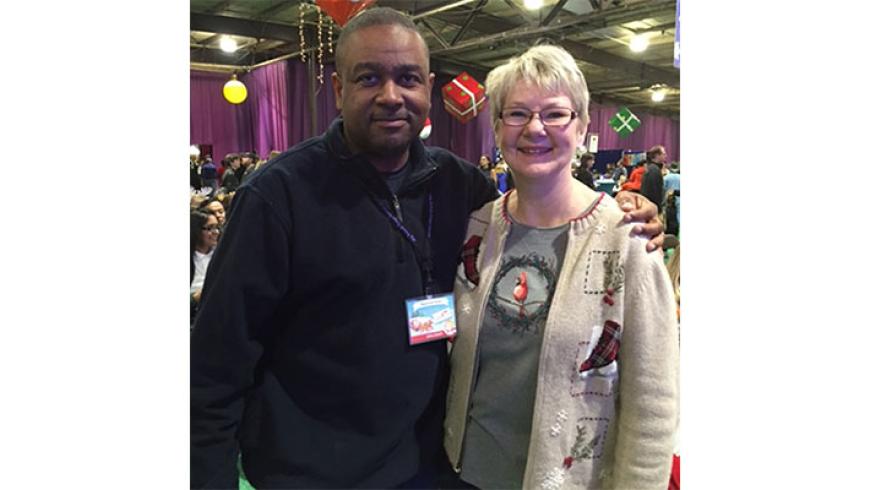 A man and a woman pose for a photo. 