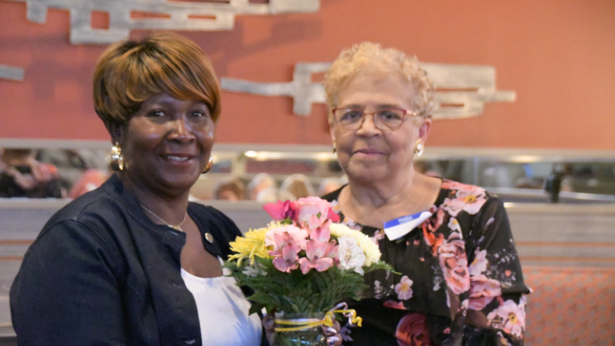 Two women pose for a photo during the event. 