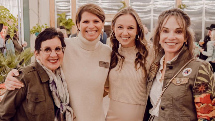 Four women stand for a group photo at Barrels & Bonfires 2022