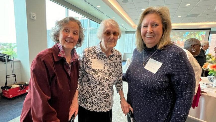Three women smiling.