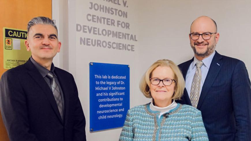 Dr. Ali Fatemi, Sally Johnston and Dr. Brad Schlaggar, president and ceo of Kennedy Krieger Institute, stand outside of the Johnston Lab during its opening ceremony