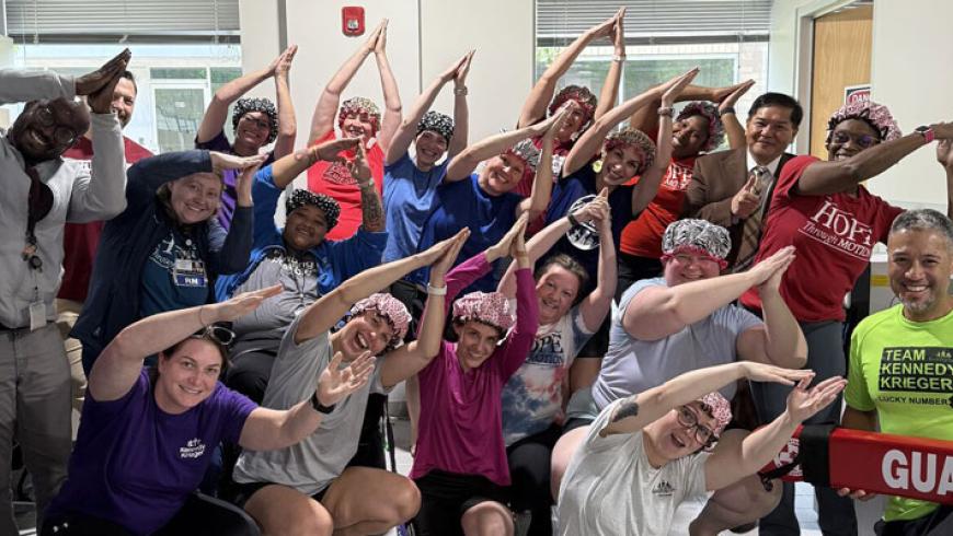 ICSCI team members in a large group photo at the aquatic therapy center.