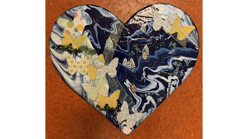 A photograph of an orange monarch butterfly perched on a purple flower with a green, blurred garden behind it.