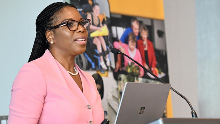 Dr. Mirian Ofonedu, Director of Training for the Maryland Center for Developmental Disabilities, gives a speech at the podium.