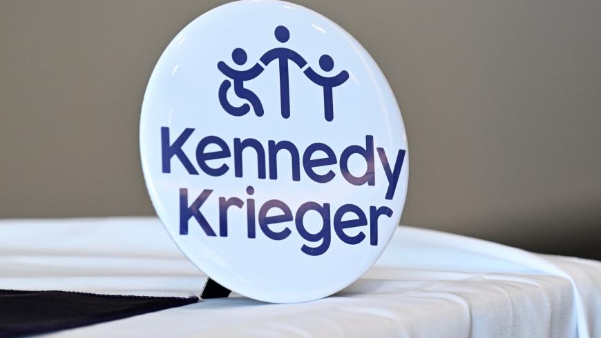 A circular white object with Kennedy Krieger's logo.