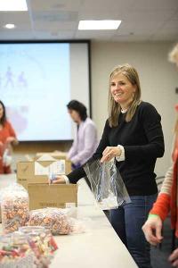 Dulany helps fill welcome bags for inpatient families.